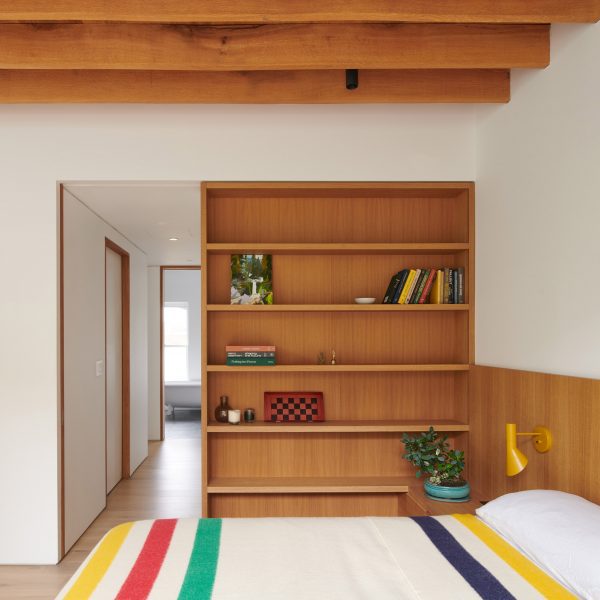 Bedroom with custom oak bed and built-ins