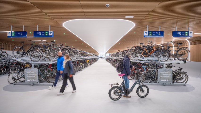 Interior view of IJboulevard bike parking facility by VenhoevenCS Architecture + Urbanism