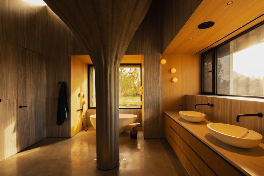 Bathroom in house with massive concrete pillar
