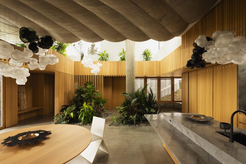 A kitchen with wood paneling