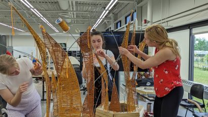 Students constructing a sculpture