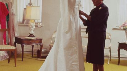 Fashion designer Ann Lowe fitting a dress