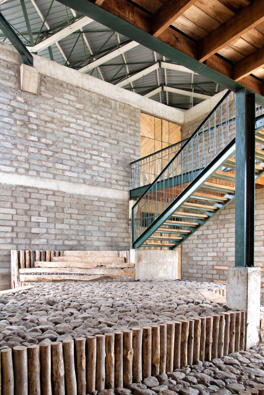 Green metal staircase in a blockwork school