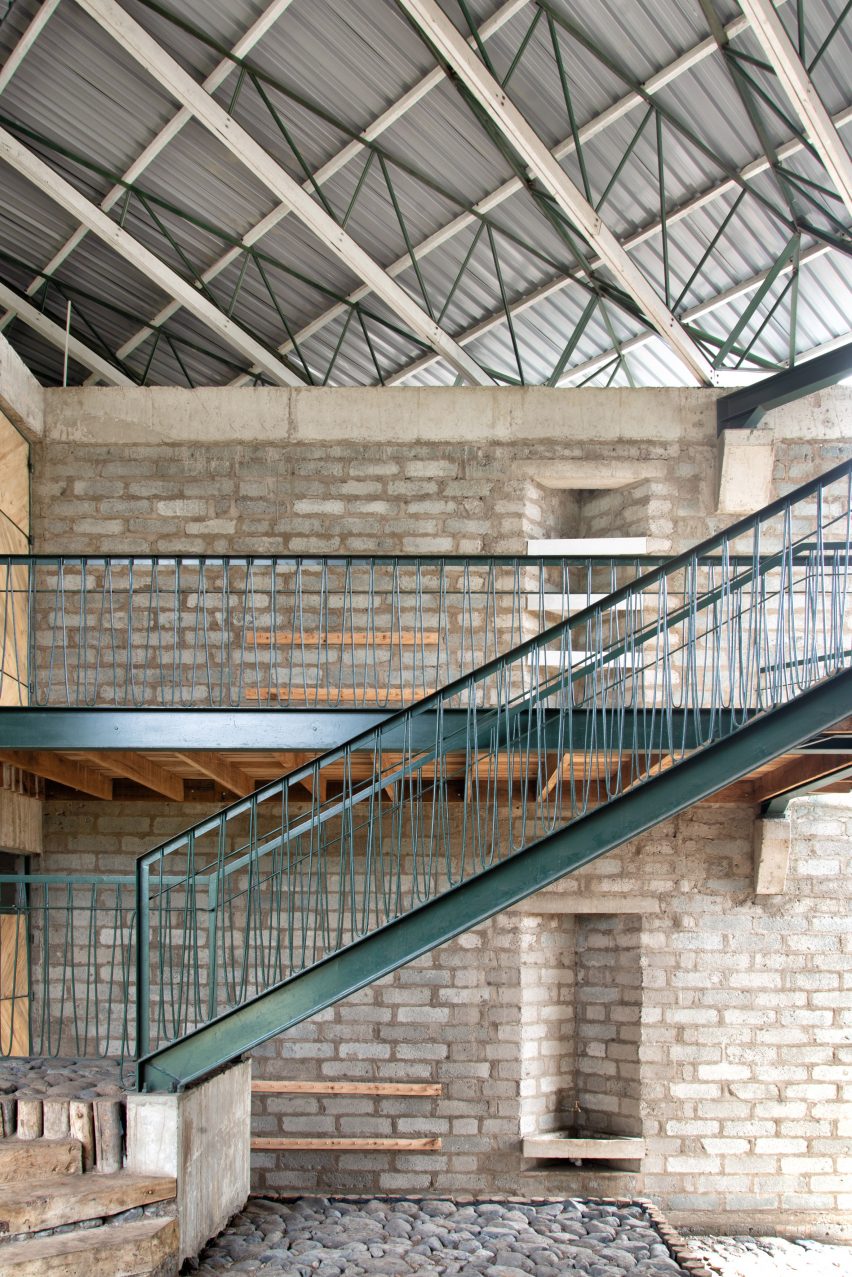 Green metal staircase in a blockwork school