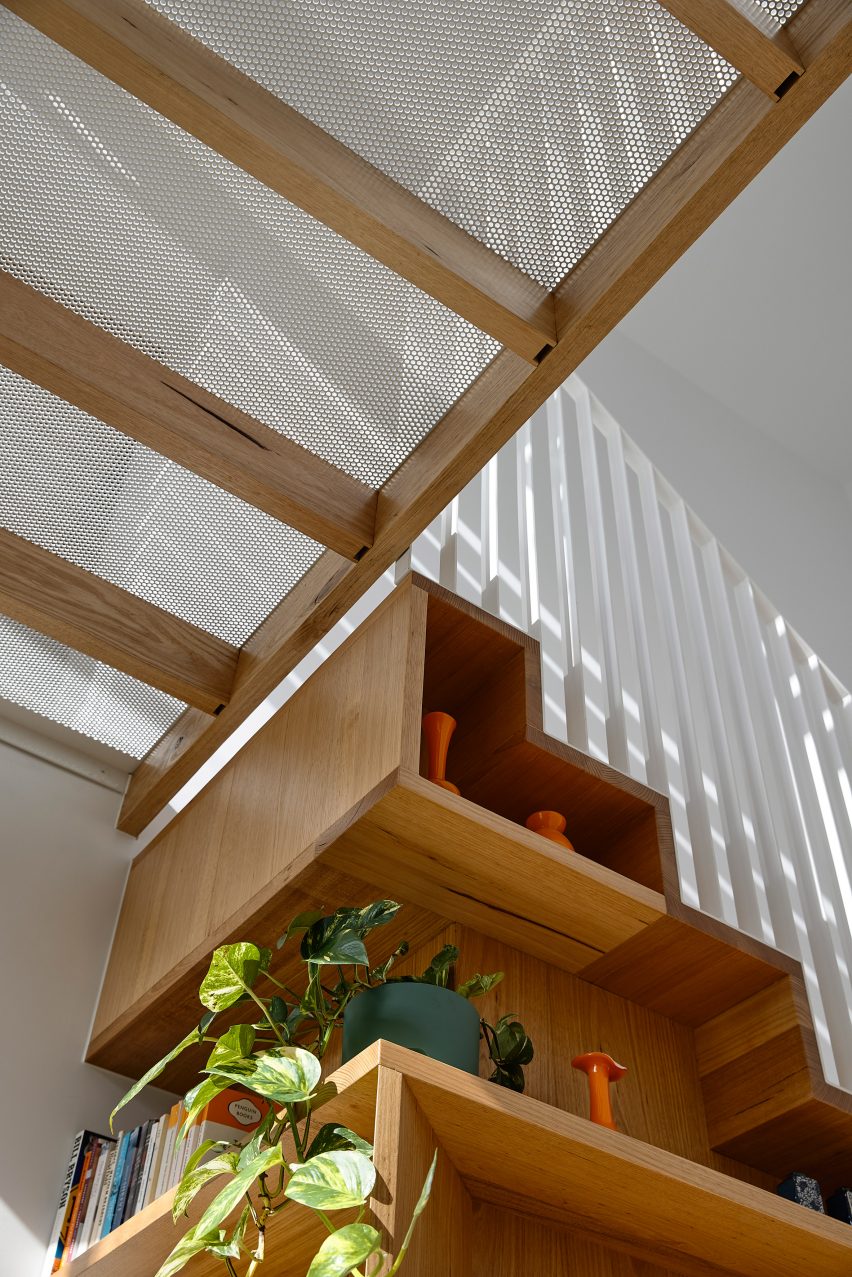 Metal bridge above staircase in Fitzroy house renovation by Austin Maynard Architects