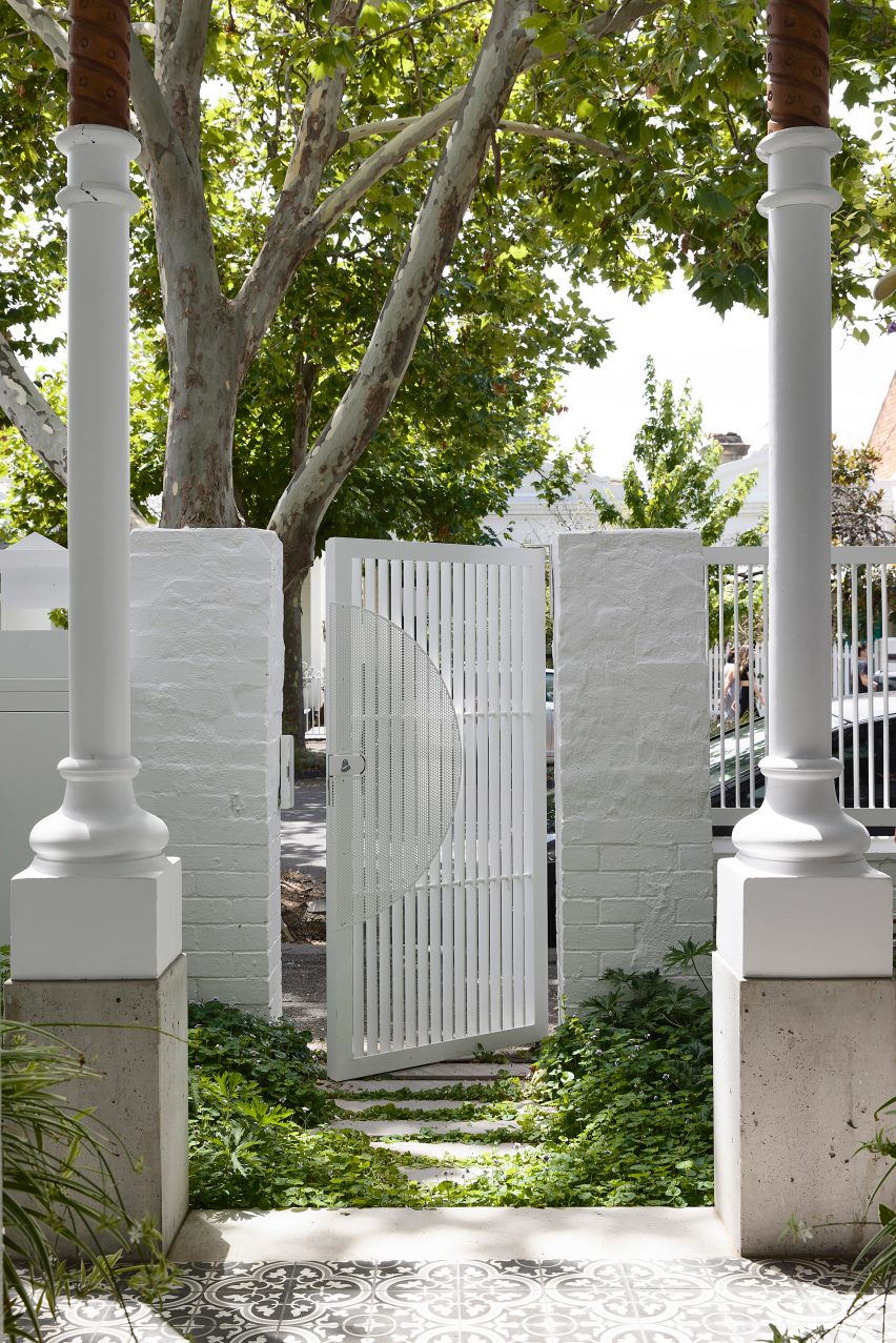 Open gate entering onto patio area at Helvetia house in Australia