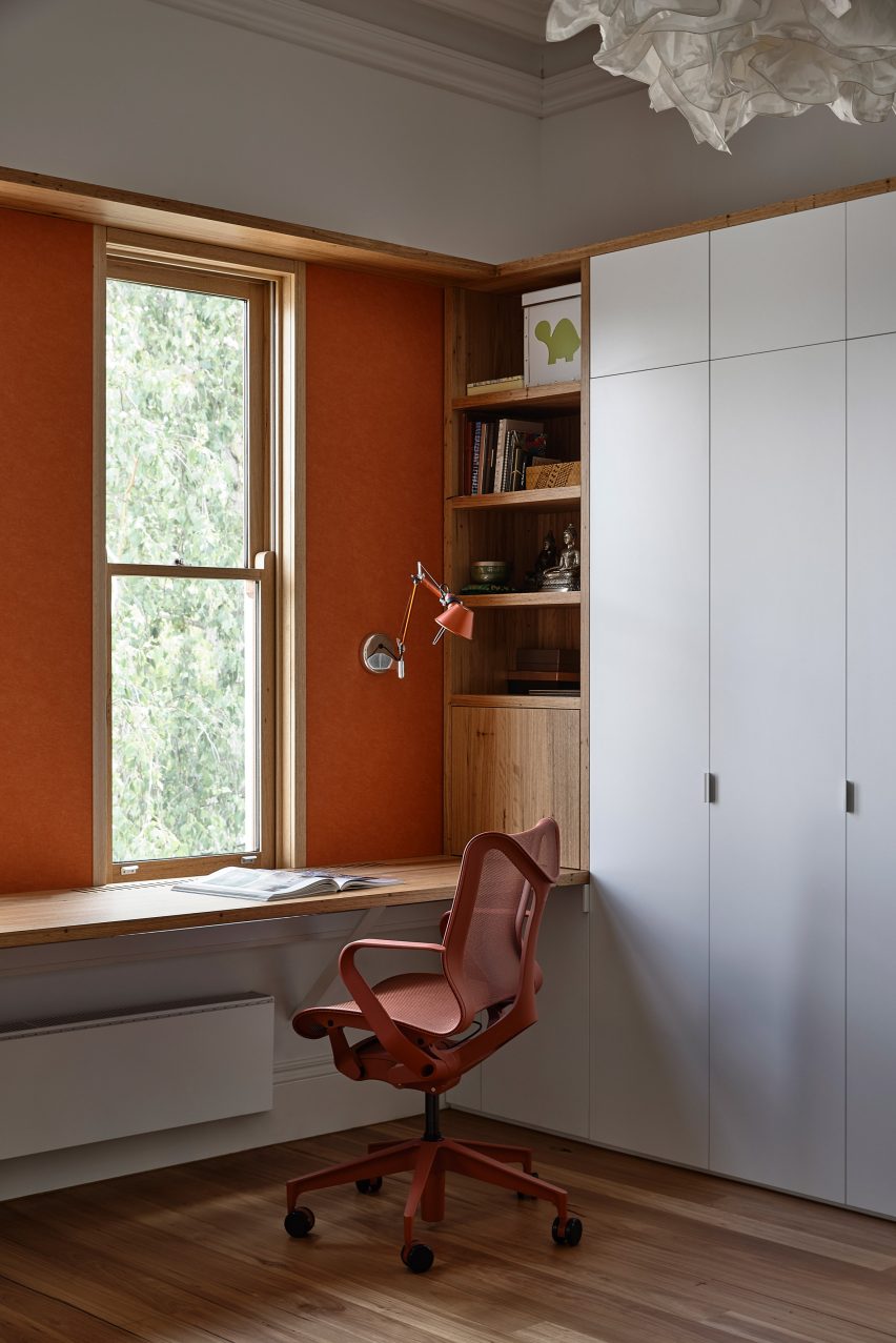 Painted orange study space in first floor studio of house by Austin Maynard Architects
