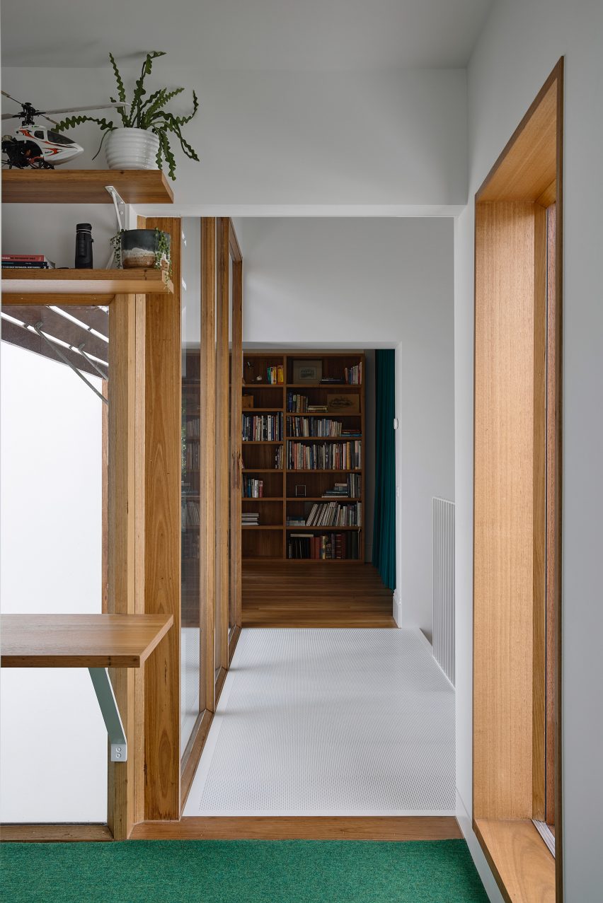 Perforated metal bridge between primary bedroom and studio space of Helvetia house Melbourne