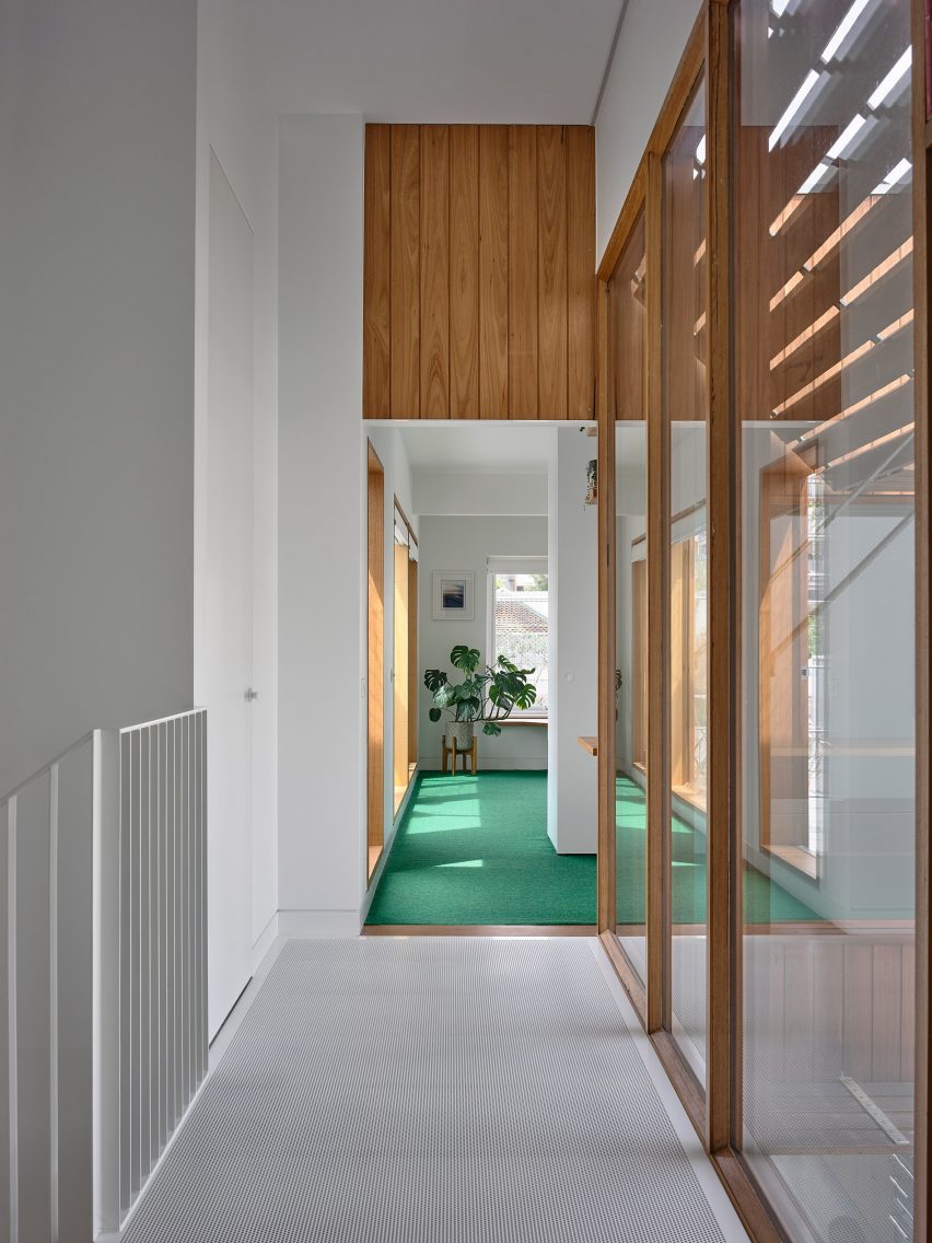 Metal walkway above void in Australian house renovated by Austin Maynard Architects
