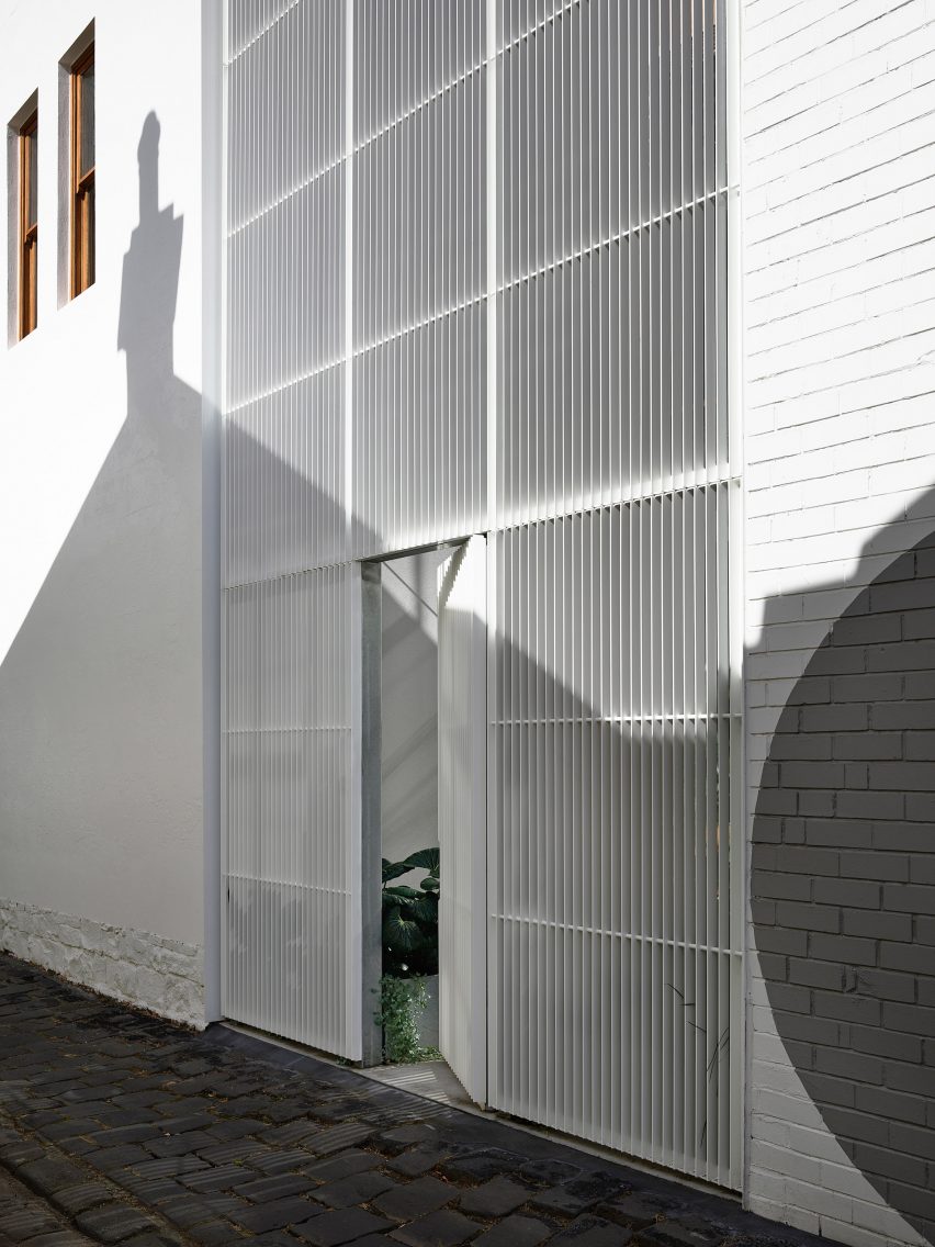 Metal grate between side laneway and entrance to Helvetia house Melbourne