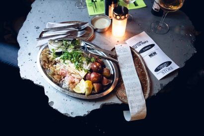 Long receipt next to seabass dish at New Store 1.0 pop-up