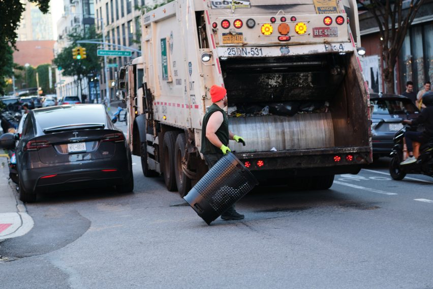 A person throwing away trash