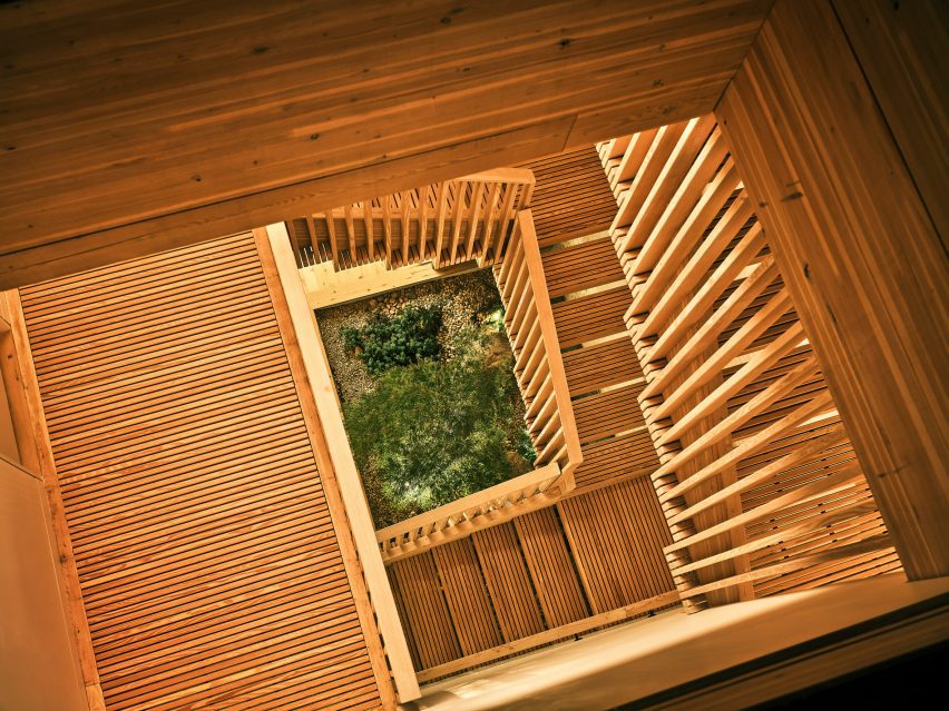 A planting bed at the bottom of a wooden staircase