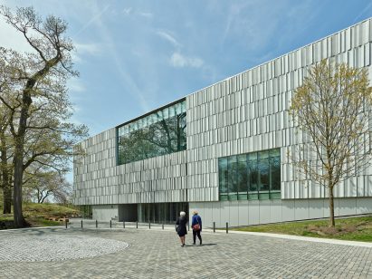 People walking in front of building