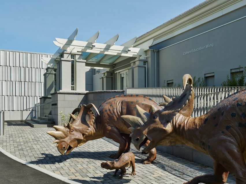 Dinosaurs outside of a museum