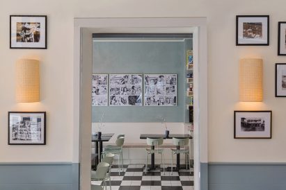View through a doorway with historic photos on either side