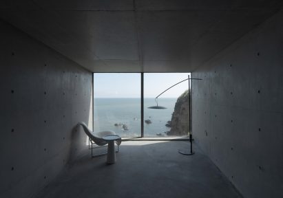 Concrete living space inside of Tower House