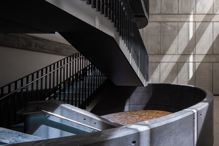 Black metal staircase in a concrete space