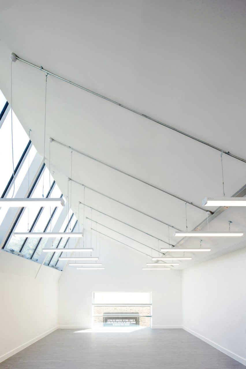 Gallery space with an asymmetrical pitched roof