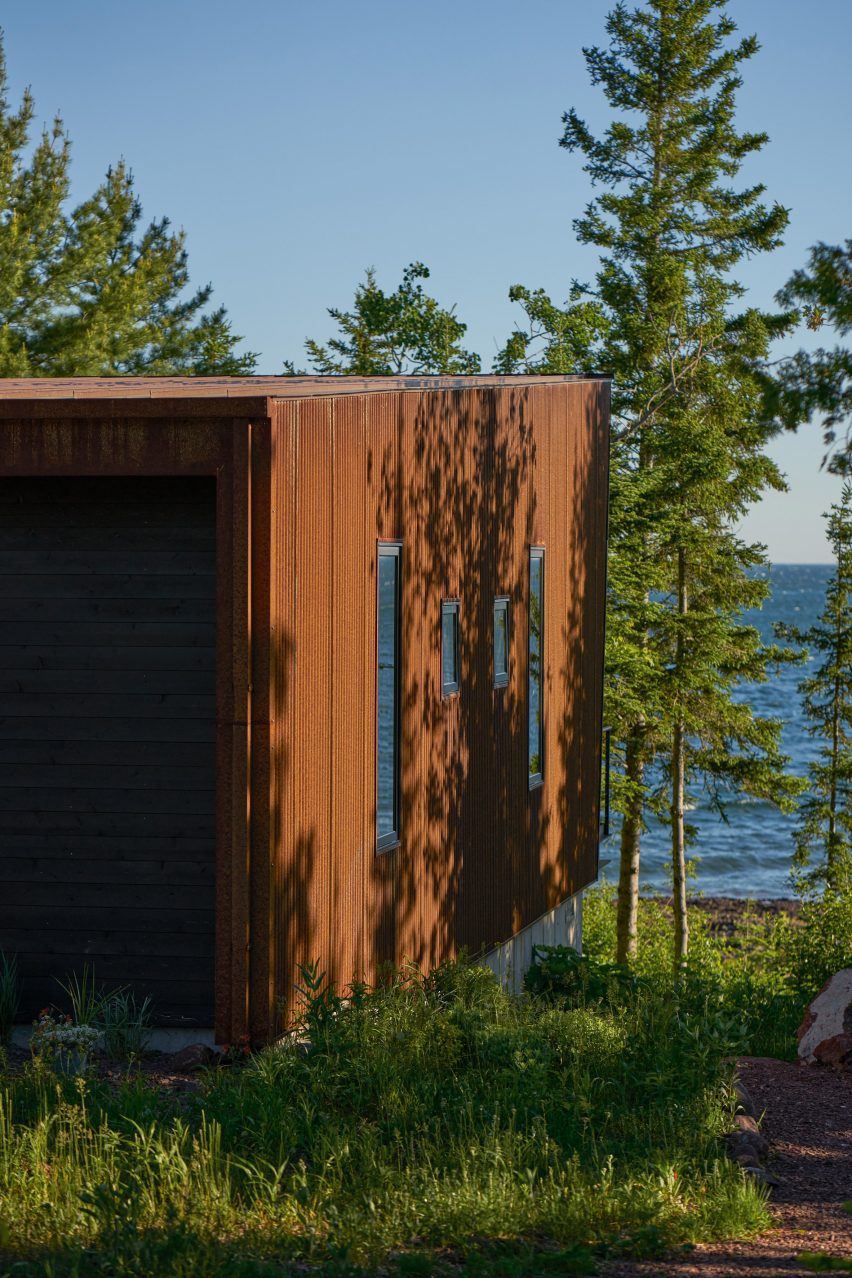 A copper clad cabin overlooking a lake