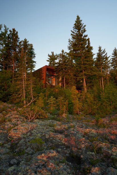 A copper clad cabin overlooking a lake