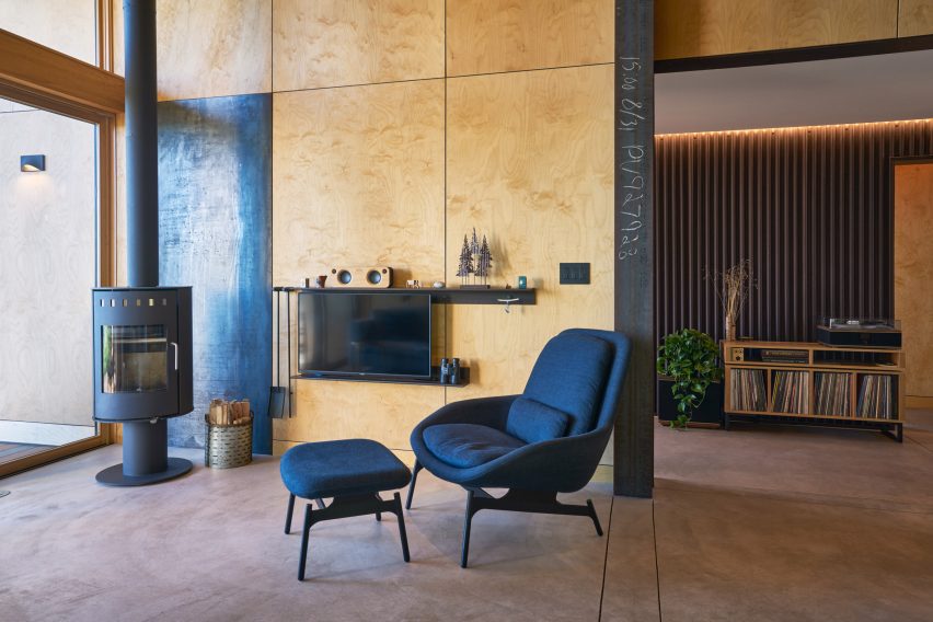 A living space with plywood walls