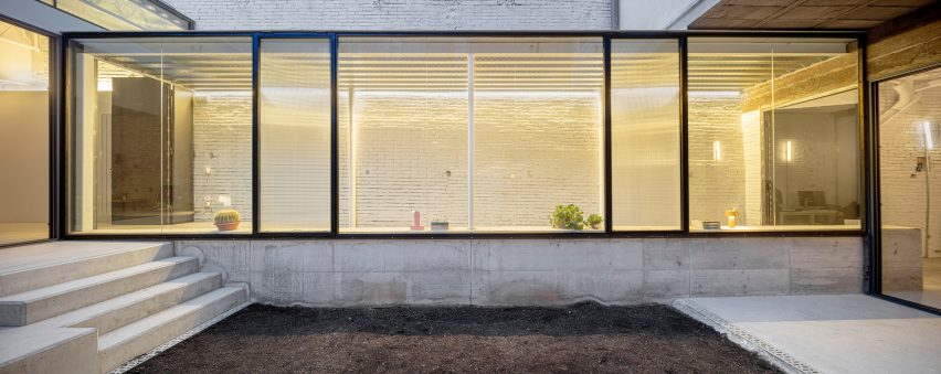 Remodelled Barcelona apartment with a glass extension by CRÜ