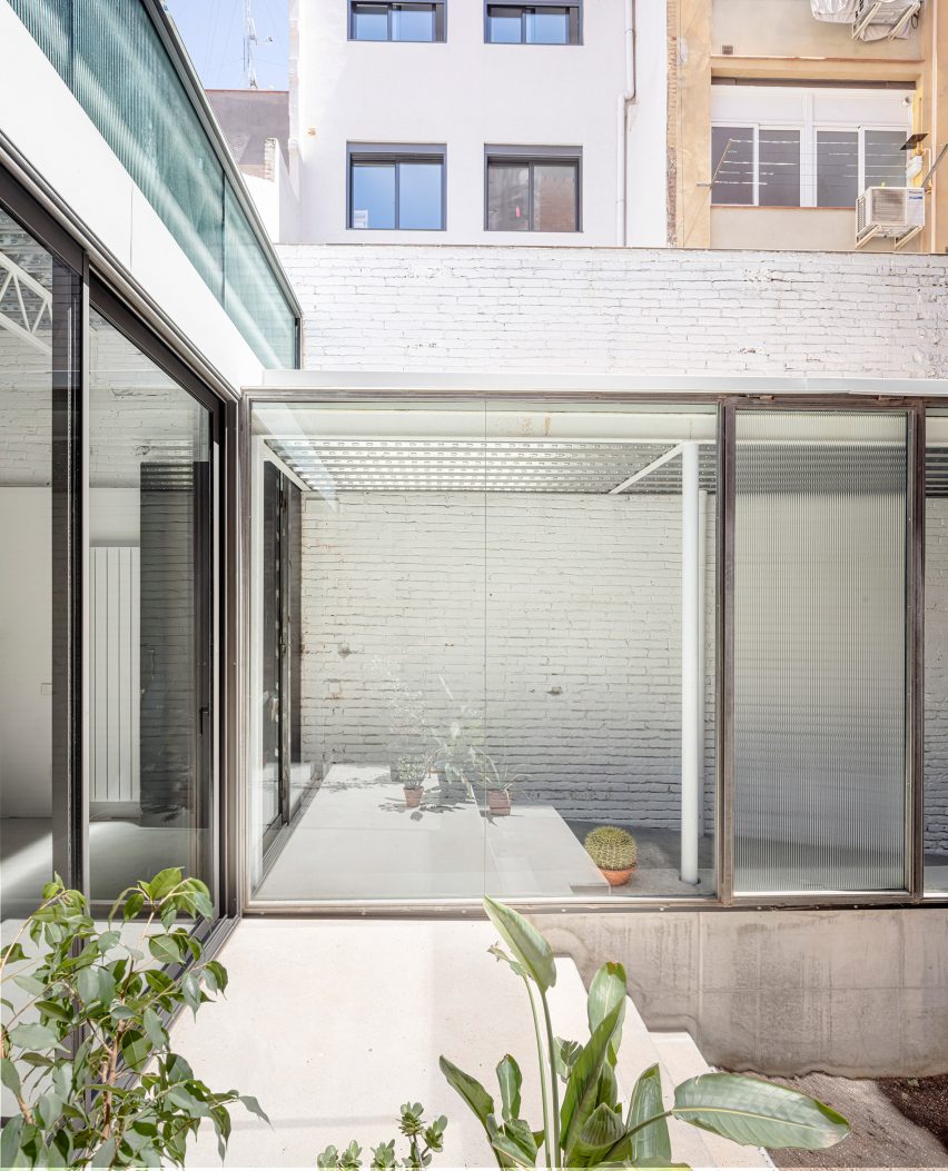 Remodelled Barcelona apartment with a glass extension by CRÜ