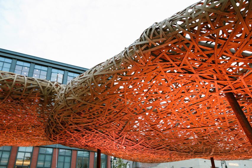 a cloud of bamboo illuminated by a red light