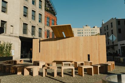 a pavilion made of CLT panels with small chairs