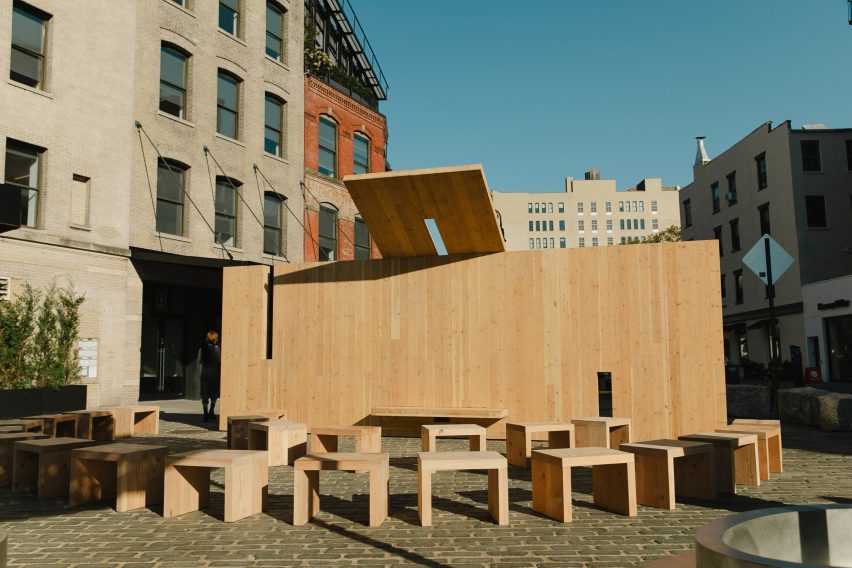 a pavilion made of CLT panels with small chairs