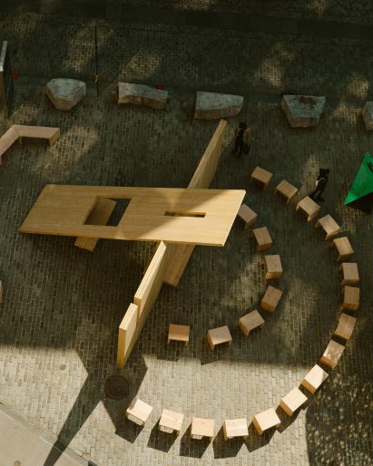 CLT panels create a pavilion in a nyc square with small chairs