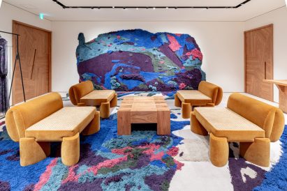 Shop interior with rug-like installation on walls and floors