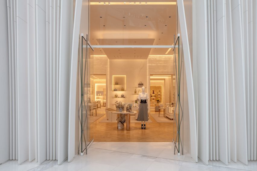 Two mannequins in a Dior store