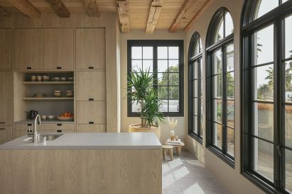 A large kitchen with light wood cabinetry