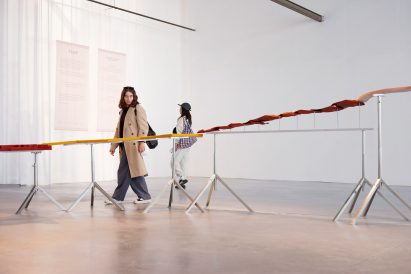 Woman walking next to Flow fountain installation by Dutch Invertuals at Dutch Design Week