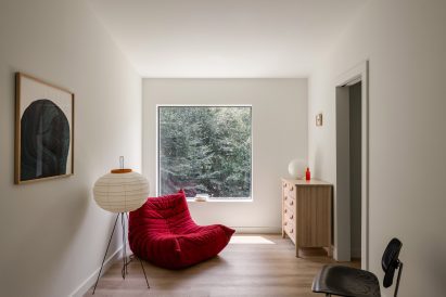 A red togo chair in a living room