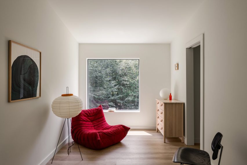 A red togo chair in a living room