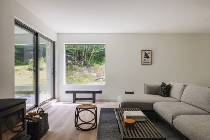 A living room with a woodstove fireplace
