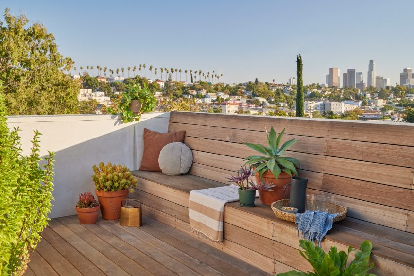 A porch with wooden seating