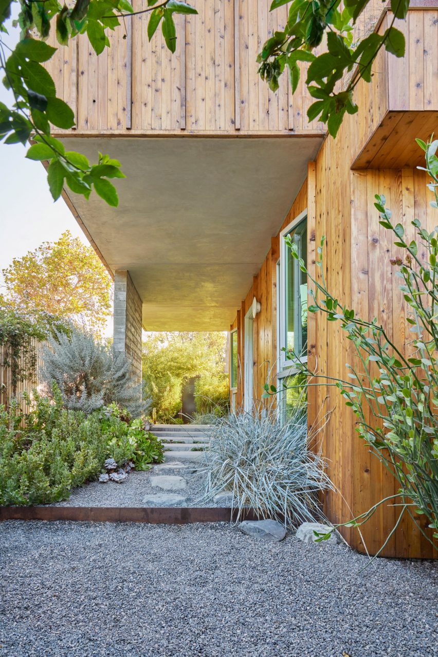 A wooden house with porch areea