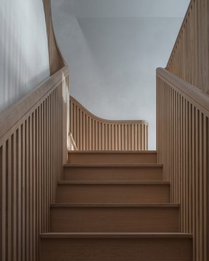 View up the staircase with balustrades on either side