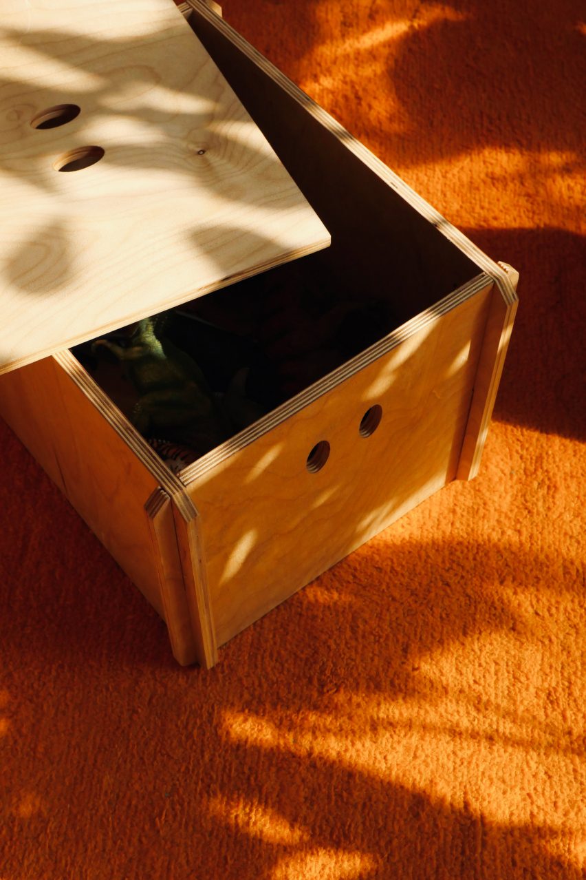 A storage box with eyes cut into it