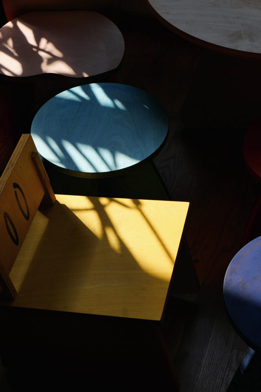 A yellow chair with eyes on the back