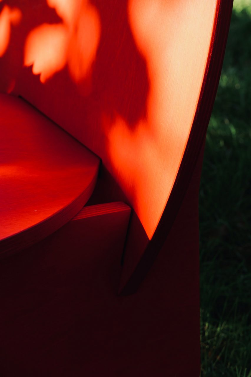 A detail photograph of a red chair