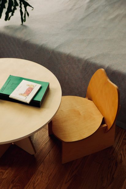 A wooden table and chair for children