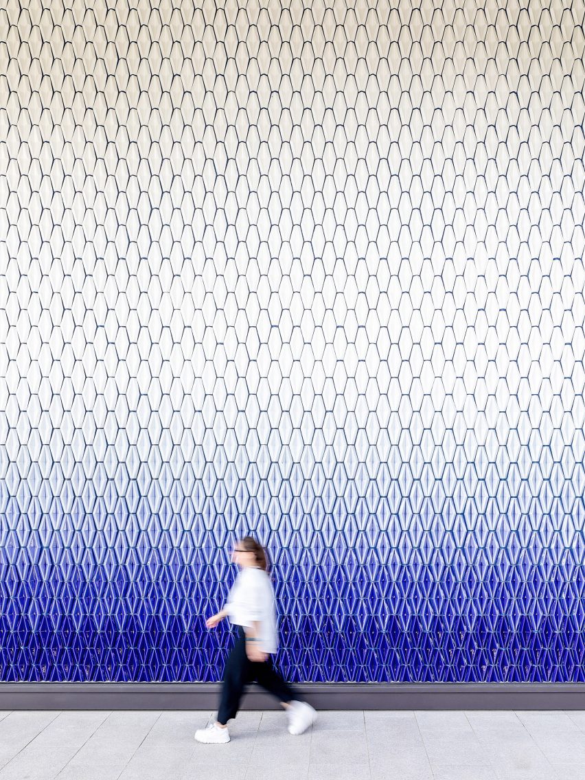 Geometric wall tiles fading from blue to white