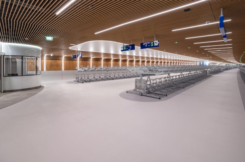 Interior view of IJboulevard bike parking facility by VenhoevenCS Architecture + Urbanism