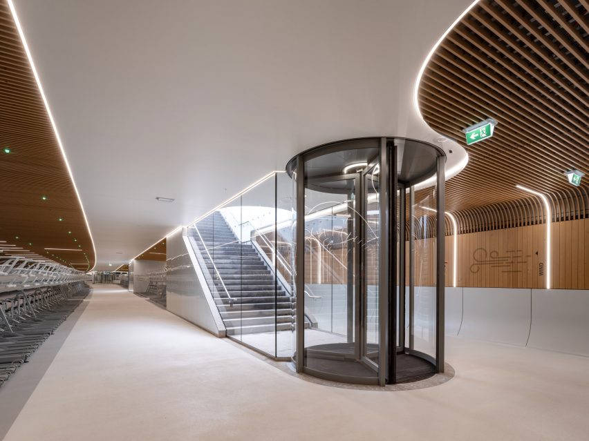 Interior view of IJboulevard bike parking facility by VenhoevenCS Architecture + Urbanism