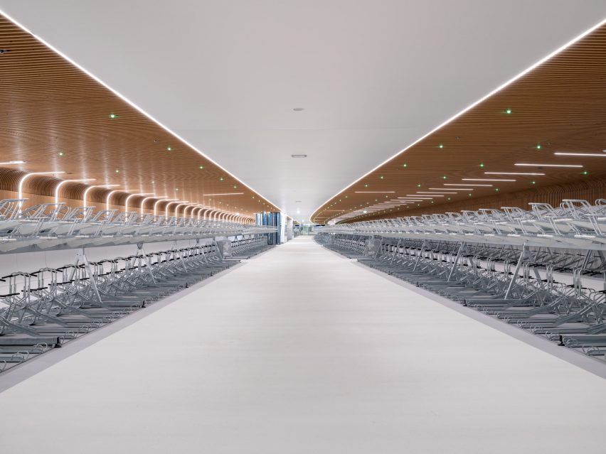 Interior view of IJboulevard bike parking facility by VenhoevenCS Architecture + Urbanism